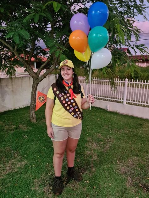 she's wearing a yellow shirt, brownish shorts, combat boots, a brown ribbon full of scout badges and she's holding balloons Russel Up Costume Diy, Russel Costume, Russell Up Costume, Russell Costume, Russel Up, Bike Night, Movie Character Costumes, Up Movie, Up Costume