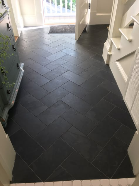 Herringbone Tile Entry, Black Hexagon Tile Mudroom, Gray Hexagon Tile Floor Mudroom, Dark Tiled Kitchen Floors, Lvt Tile Flooring Bathroom, Farmhouse Basement Flooring, Black Floor Tile Laundry Room, Black Mudroom Tile, Black Herringbone Tile Floor Entryway