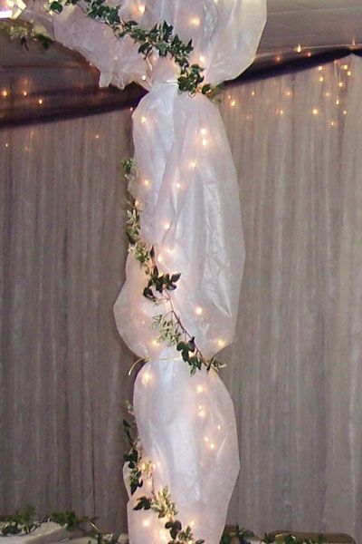 Gossamer and tulle are a way to decorate the wedding and reception venues with inexpensive elegance. Wedding Arch Tulle, Tulle Wedding Decorations, Pillar Decor, Tulle Decorations, Fun Wedding Decor, Wedding Ceremony Ideas, Lights Wedding Decor, Arch Decoration Wedding, White Lights