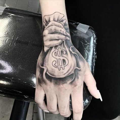 Money Bag Tattoo On Hand Money Bag Tattoo Behind Ear, Money Bag Tattoo On Hand, Hand Tattoo Men, Money Sign Tattoo, Dollar Sign Tattoo, Money Bag Tattoo, Dollar Tattoo, Bag Tattoo, Money Tattoo