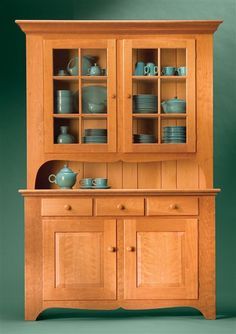 Classic Country Hutch American style and classic hardwood create a timeless treasure By Tim Johnson Tall and stately, this cupboard promises to be the focal point of any dining area. A functional wonder, it combines elegant display with spacious storage. For you as a builder, though, this cupboard is loaded with something quite different: advanced techniques that will challenge your woodworking skill. It has all the stuff to be your … Country Hutch, Crockery Cabinet, Woodworking Desk, Woodworking Cabinets, Woodworking Bed, Woodworking Basics, Woodworking Logo, Woodworking Toys, Woodworking Magazine