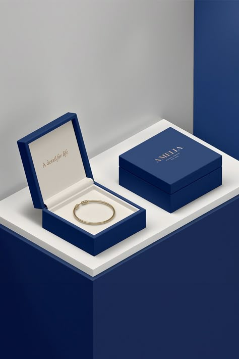 Jewelry store branding and packaging design in gold and blue. Gold Jewelry Packaging, Minimal Jewelry Branding, Jewelry Minimal, Blue Jewelry Packaging, Jewellery Box Packaging, Jewellery Branding, Luxury Elegant Jewelry With Metal Logo, Jewelry Brand, Luxury Jewellery Brand Logo