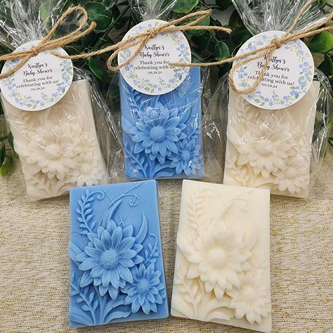 Our wildflower soap favors are the perfect addition to any baby shower or bridal shower.  Each soap is individually wrapped in a cellophane bag and tied with twine, making them a beautiful and elegant gift for your guests.  The soaps are delicately scented with the fragrance that you choose, creating a refreshing and relaxing sensory experience. The intricate rose designs are carefully crafted and colored, bringing a touch of whimsy and beauty to these handmade favors.  These soap favors not onl Baby In Bloom Shower Decorations, Baby Shower Soap Favors, Gift For Guests, Handmade Favors, Wildflower Baby Shower, Baby In Bloom, Shower Soap, Soap Favors, Garden Gift