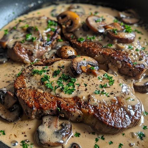 🥩 Experience the ultimate indulgence with our Pan-Seared Garlic Butter Steak with Mushroom Cream Sauce! 🥩✨ #SteakLovers #GourmetMeals Pan-Seared Garlic Butter Steak with Mushroom Cream Sauce Ingredients: Ribeye steaks (2) Butter (1/4 cup) Garlic cloves, minced (4) Mushrooms, sliced (2 cups) Heavy cream (1 cup) Olive oil (2 tbsp) Salt (1 tsp) Black pepper (1/2 tsp) Fresh parsley, chopped (for garnish) Instructions: Heat olive oil in a skillet over medium-high heat. Season steaks with salt ... Steak With Mushroom Sauce, Steak And Vegetables, Steak With Mushrooms, Mushroom Steak, Mushroom Dishes, Mushroom Cream Sauce, Butter Steak, Easy Steak Recipes, Garlic Butter Steak