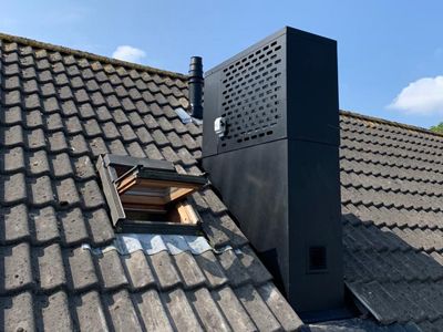 ECONEXT Heat pump cover-up Chimney Covering Ideas, Zombie Proof House, Heat Pump Cover, Cobblestone Patio, Pump Covers, Narrow House Designs, House Extension Design, Narrow House, Room With Plants