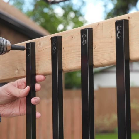 These surface-mounted, rectangular balusters are perfect for enhancing decks, porches, gazebos, and more. It's an easy way to accent your outdoor project while simultaneously adding beauty, strength, and safety. Not only are they versatile for many types of projects, but they also complement and install easily on composite, vinyl, wood, and more. Whether you're a busy contractor or a DIYer looking for an easy backyard upgrade, these balusters will be perfect for you. Ultimately, their strong, galvanized steel construction will not only outlast the competitor's leading aluminum baluster but also transform your environment. Nuvo Iron 1/2-in x 1-in x 38-in Black Powder Coated Galvanized Steel Rectangular Deck Baluster | RCTB38-ESP Railing For Decks Simple, Metal Rails For Front Porch, Update Deck Railing, Outdoor Patio Railing Ideas, Face Mount Balusters Interior, Cheapest Deck Railing, Affordable Deck Railing Ideas, Cheap Porch Railing Ideas, Railing Alternatives