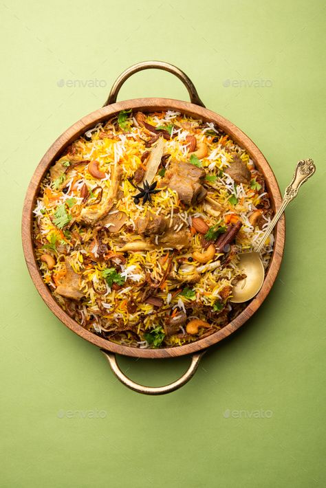 Indian Mutton biryani prepared in Basmati Rice served with Yogurt dip over moody background, Selective focus Biryani Wallpaper, Biryani Photography Indian, Mutton Biryani Photography, Biryani Images, Biryani Photography, Mutton Dum Biryani, Moody Background, Beef Biryani, Mutton Biryani