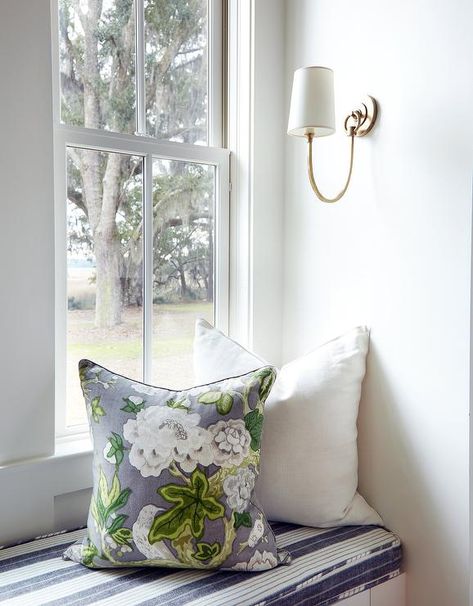 Reed Single Sconce lights a window seat nook boasting a white built-in window seat topped with a white and black striped seat cushion. Cottage Den, Wall Seat, Blue Plaid Pillows, Window Seat Nook, Bedroom Window Seat, Window Storage, Built In Window Seat, Window Bench Seat, Window Seating