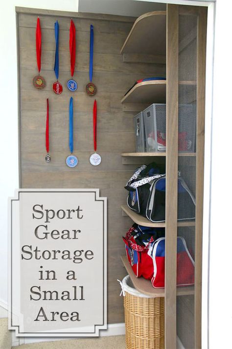 Build sports gear storage shelves in the small space at the bottom of your stairs. Added mesh siding gives a locker vibe and allows for better air flow. Sports Bag Storage Ideas, Sports Bag Storage, Storage Shelves Diy, Sports Gear Storage, Diy Storage Projects, Small Storage Shelves, Sports Equipment Storage, Gear Wall, Homework Room