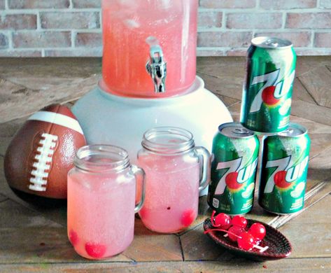 7UP Fruity Football Party Punch. This alcoholic party punch is sure to be a favorite with your guests. Mix 7UP with pink lemonade, vodka and triple sec. Football Party Punch, Alcoholic Party Punch, Super Bowl Punch, Super Bowl Drinks, Party Punch Alcohol, Alcoholic Party, Pink Lemonade Vodka, Triple Berry Pie, Super Bowl Decorations