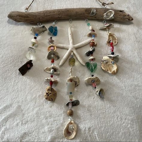 One Of A Kind Handcrafted Hanging Driftwood Ocean Sun Catcher Hand Picked Multi Color Sea Glass Hand Picked And Polished Sea Shells And Natural Driftwood Crystal And Gemstone Accents Aura Sun Catcher Window / Wall Decor Beachy Boho Aesthetic Beautiful Light Refraction In Daylight All Natural Driftwood, Sea Shells, Sea Glass And Sandstone/Holy Rock Hand Picked From Matagorda Beach Length From Driftwood To Longest Strand 20” Length From Rope To Longest Strand 30” Width 20” Stone And Driftwood Art, Sea Glass Hanging Art, Room Decor With Shells, Driftwood Sun Catcher, Whelk Shell Crafts, Sea Witch Decor, Ideas For Sea Shells Diy Seashell Crafts, Diy Seashell Wind Chime, Driftwood Crafts Wall Hangings