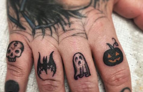 Halloween finger tatts Awesome Finger Tattoos, Halloween Finger Tattoos For Women, Small Halloween Finger Tattoos, Hand Tattoos Halloween, Goth Finger Tattoos For Women, Bat Tattoo On Finger, Halloween Knuckle Tattoos, Creepy Finger Tattoos, Halloween Hand Tattoos For Women