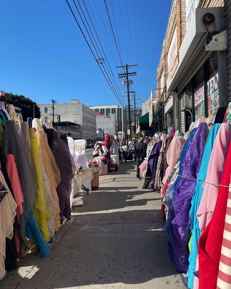 The LA Garment District was originally defined in1972 by the LA Times as being along Los Angeles Street from 3rd to 11th Street. The area was virtually unknown to most residents at the time. By 1982, the district had grown to a roughly 20 block area with about 500 retail outlets. Today, it has more than 4,000 independently owned retail and wholesale businesses selling apparel, footwear, accessories, and fabulous fabrics! #mre #margireed #garmentdistrict #losangeles #fashion Goth Stores, Los Angeles Fashion District, La Fashion District, Fashion District Los Angeles, Los Angeles Street, Block Area, Fabric Shopping, Los Angeles Fashion, Fashion District