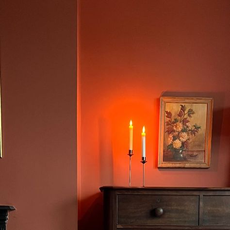 Abigail Rogers | Colourful Interiors & Modern Classic Style on Instagram: "1 Cosy Bedroom Corner 🕯️ ✨- in 4 ways! Which is your favourite?  Although this bedroom was only decorated just over a year ago this shows how much I like to shift furniture around! But really this post is to hail the impact of this beautiful warm terracotta paint colour on this previously greyish north facing room! Captured in different seasons and lights - this room still glows!  Have you got a paint colour that never fails to evoke warmth and cosiness? I also think this is me slowly easing into Autumn as I sit here with a big woolly jumper on!  Hoping for a paint delivery tomorrow so I can crack on with the big project! But just realised I also have 3 floors of panelling to do too!! Happy Thursday lovely people X Orange Room Paint, Burnt Orange Panelling, Orange Panelling Bedroom, Terracotta Red Bedroom, Dulux Tuscan Terracotta, Farrow Ball Red Earth Bedroom, Terra Cotta Paint Color, Terracotta Living Room, Terracotta Paint