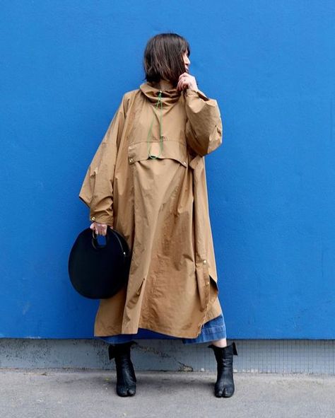 THE ASSEMBLY LINE on Instagram: "We are thrilled to see @joliesbobines version of the #talhoodieponcho poncho! 🥳 "LOST IN BLUE • there are projects like this that make me want to sew again and again! The #talhoodieponcho cape from @theassemblylineshop immediately caught my eye when I saw it! I love its oversized style, its large pocket, the topstitching, the press studs, the eyelets to tighten the hood, the opening on the sides... in short, a crush!" 🥰 Julie's poncho is made in a tone-on-tone plaid waterproof fabric in camel polyamide and nylon. And for the elastic cord she chose green for the contrast. The Hoodie poncho is a one-size-fits-many design. Large enough to be worn over any outfit whenever the weather calls for it. Bring it packed in its own pocket and you're always prepared Always Prepared, Hoodie Poncho, Short A, Assembly Line, A Crush, Oversized Style, The Press, Bring It, Press Studs