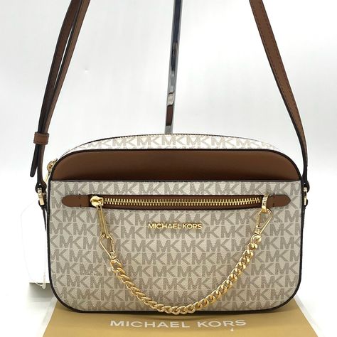 Brand New With Tag Michael Kors Lg Ew Zip Chain Crossbody Bag Pvc And Saffiano Leather Zippered Top Closure Color: Vanilla Gold-Tone Hardware Michael Kors Lettering Logo On Front Inside: 1 Large Padded Pocket, & 1 Slip Pockets Outside: 1 Back Pocket And 1 Zip Pocket And 1 Slip Pocket On The Front Mk Signature Fabric Lining L: 9.5" X H: 6.2" X W: 2" W/ Adjustable 22” Leather Crossbody Strap Does Not Include Dust Bag Mk Purse, Crossbody Bags For Travel, Michael Kors Crossbody Bag, Brown Leather Handbags, Rattan Bag, Lettering Logo, Black Leather Backpack, Black Leather Crossbody Bag, Faux Leather Belts