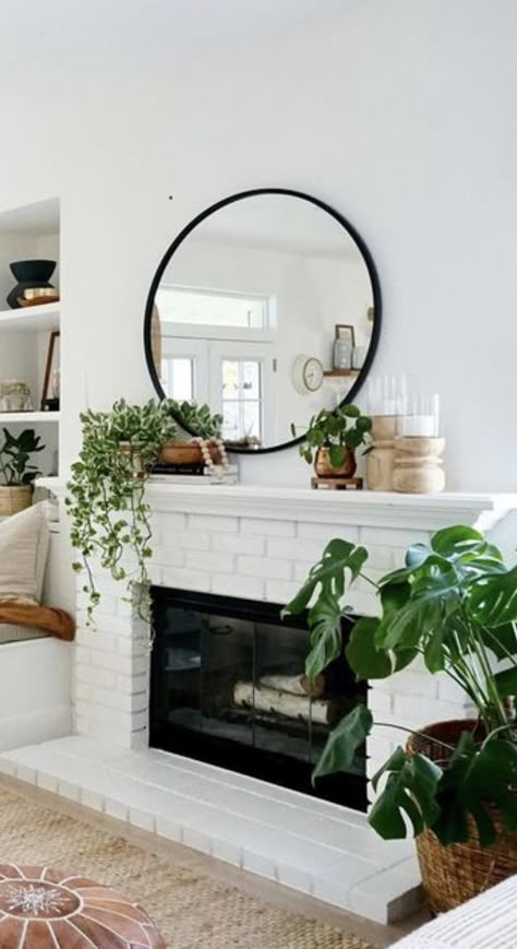 Mantle Decor Circle Mirror, Mantle With Circle Mirror, Black Round Mirror Over Fireplace, Plants For Fireplace Mantle, Round Mantle Mirror, Modern Boho Mantle Decor, Black Mirror Fireplace, Mantel Decor With Round Mirror, Circle Mirror Over Fireplace