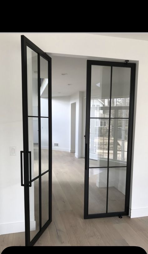 Black Frame Office Door, Glass Doors With Black Frame, Door To Basement Ideas, Glass Study Doors, Modern Double Pocket Doors, Black Metal Doors Interior, Double Interior Doors Ideas, Metal Door Interior, Black Metal Doors Office