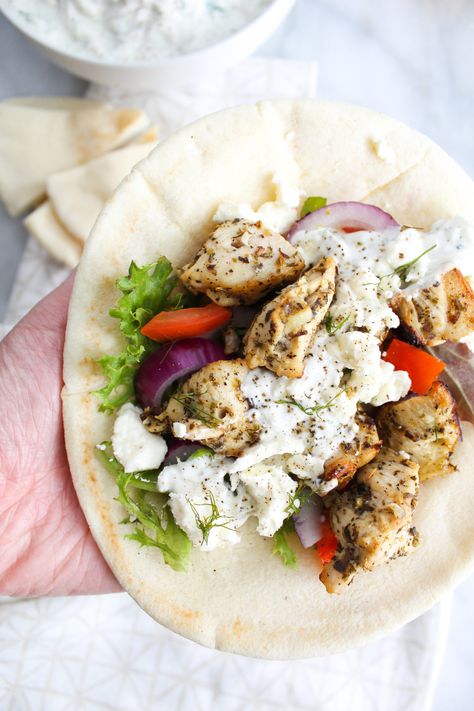 super close up chicken souvlaki pita in hand Chicken Slovaki Pita, Chicken Slovaki, Chicken Souvlaki Wrap, Lunch Cravings, Chicken Slovaki Recipe, Chicken Souvlaki Pita, Souvlaki Pita, Sandwiches Vegetarian, Cypriot Recipes