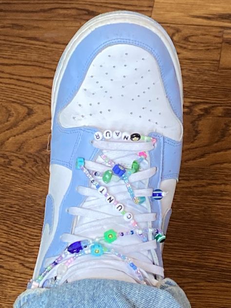 pastel and saturated photo of a blue and white nike sneaker with beads with flower charms also letter charms that spell c u n t and naur Shoes Drawing Ideas, Shoes Y2k, Shoes Colorful, Book Drawing Ideas, Scratch Book, Y2k Shoes, Shoes Drawing, Drawing Ideas Easy, Colorful Shoes