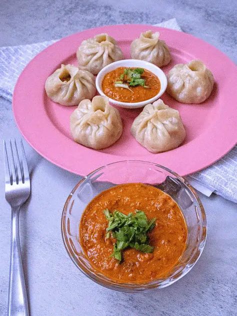 Learn how to make spicy Nepali momo sauce at home with this easy recipe. Serve your freshly made momo achar alongside steaming hot momos for an authentic Nepali dining experience. Momo Sauce Recipe, Nepali Momo, Momo Recipe, Pickled Cucumber Salad, Easy Dipping Sauce, Soya Chunks, Chili Spices, Vegetarian Cabbage, Tomato Sauce Recipe