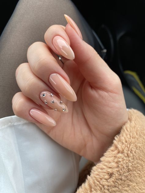 Minimalist Gem Nails, Easy Nails With Rhinestones, Almond Nails With Rhinestones Classy, Nude With Rhinestone Nails, Nude Nail Designs With Rhinestones, Nude Nails Rhinestones, Nude Acrylic Nails With Rhinestones, Nude Rhinestone Nails, Nails Gems Rhinestones