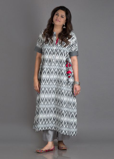 Moon Grey Mercerized Ikat Kurta with Handmade Tassels *Click on Image To Shop Latest Kurti*Best website for kurti shopping online. #Kurtishoppingonline #buykurtisonline #designerkurtionline Ikat Dress Designs Latest, Ikat Dress Kurti Neck Designs, Ikat Suit Designs, Ikat Dress Kurti, Ikat Kurti Designs, Ikat Kurta Designs, Ikkat Kurta Designs, Ikat Kurti, Ikkat Kurti Designs