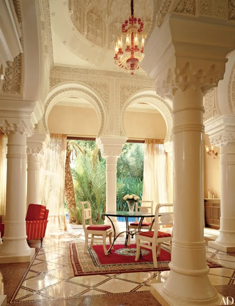 With exposed wood beams, textured walls, and a 17th-century Italian walnut front door, this foyer is composed of traditional Mediterranean elements. The Malibu beach house was devised by architect Douglas Burdge and the owner of the home, designer Richard Shapiro. The sculptural staircase is a modern contrast to the 19th-century replica of an ancient Greek statue at its base. Mediterranean Room, Mediterranean Furniture, Mediterranean Home Interior, Rustic Mediterranean, Mediterranean Interior Design, Mediterranean Mansion, Mediterranean Aesthetic, Mediterranean Interior, Mediterranean Style Home