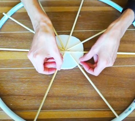 Hula Hoop Wagon Wheel - Wreath Ideas - DIY At Dollar Tree Diy Wagon Wheel Hula Hoop, How To Make A Wagon Wheel, Wagon Wheel Diy, Wagon Wheel Wreath, Antique Wagon Wheels, Rustic Graduation Party, Wagon Wheel Decor, Wheel Wreath, Diy Kitchen Cabinets Makeover