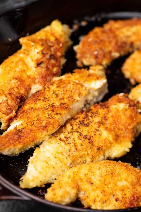 Parmesan Crusted Chicken Fingers are crispy on the outside but tender on the inside. In just 10 minutes you can make the best chicken fingers you can find. No more fast food on those busy weeknights. #butterandbaggage #chickenfingers #chicken #easydinner #weeknightdinner #parmesan Chicken Parmesan Tenders, Pan Fried Chicken Tenders, Baked Parmesan Crusted Chicken, Parmesan Chicken Tenders, Crusted Chicken Tenders, Fried Chicken Tenders, Chicken Florentine, Crispy Chicken Tenders, Pan Fried Chicken