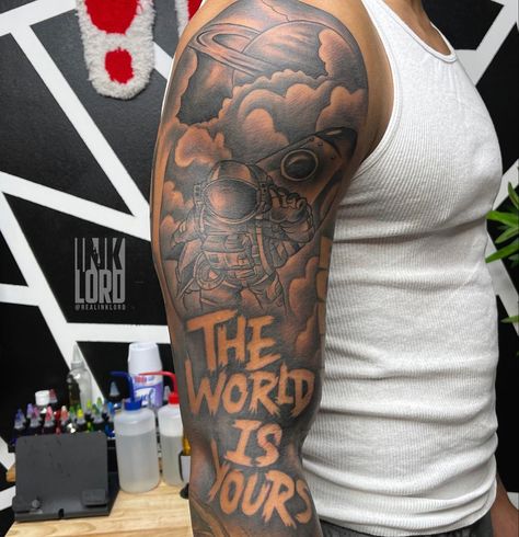 Hood Cartoon Tattoos, Top Of The Arm Tattoo Men, Upper Tattoos Arm, Skys The Limit Tattoo Men, Black Man Tattoo Sleeve, One Of One Tattoo Men, Muscle Tattoos Women, Sholdertatoos Men, Sky’s The Limit Tattoo