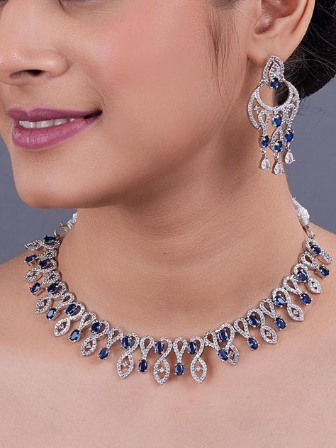 Blue American Diamond necklace/Diamond/CZ Stones Necklace Set/Elegant/Unique Jewelry/Indian/Pakistani/Bollywood/Indian Wedding/Bridal ITEM DESCRIPTION BEAUTIFUL AMERICAN DIAMOND NECKLACE SET CATEGORY : Necklace Set MATERIAL : ALLOY(Brass) OCCASION : Wedding Wear, Party Wear, Bridal COLOR : White, Blue MAKE : Handmade STONE TYPE : AMERICAN DIAMOND PLATING : White Plating READY TO SHIP : YES PACKAGE CONTENTS : 1 Necklace Set, 1 Pair Of Earrings EARRING CLOSURE TYPE : Push Back ➡️kin Friendly: This Product does not contain harmful constituents. Anti-allergic safe for skin. ➡️This Jewelry set would add more charms to your beautiful jewelry collection and would surely bring lots of compliments. ➡️Care Instructions: Keep it dust-free & dirt free in a plastic pouch. Remember to apply your hairspr Cz Stone Necklace, American Diamond Necklace Set, Stone Necklace Set, Indian Fashion Jewellery, American Diamond Necklaces, Plastic Pouch, Stones Necklace, Indian Necklace, Jewelry Ads