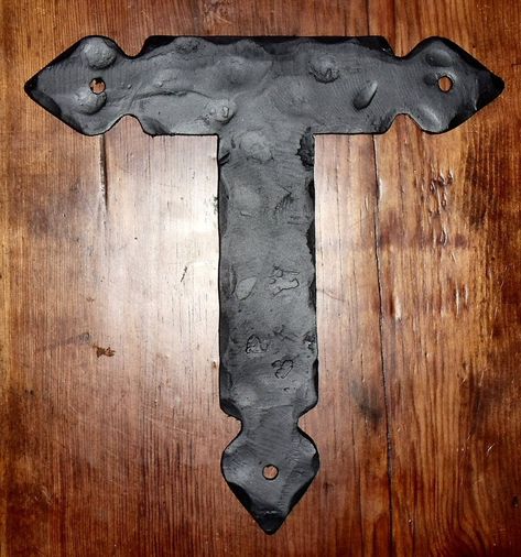 Crafted by skilled blacksmiths at Old West Iron, this Rustic Iron "T" Strap is a structural wood connector that adds a touch of charm to any space. With customizable sizing and a variety of hand-applied textures and finishes, it can serve as both a decorative and functional piece. Matching fasteners are also available. Rustic Wood Door, Iron Room, Faux Paint Finishes, Wood Connectors, Wood Hardware, Cast Iron Decor, Iron Garden Gates, Rustic Wood Box, Dog Window