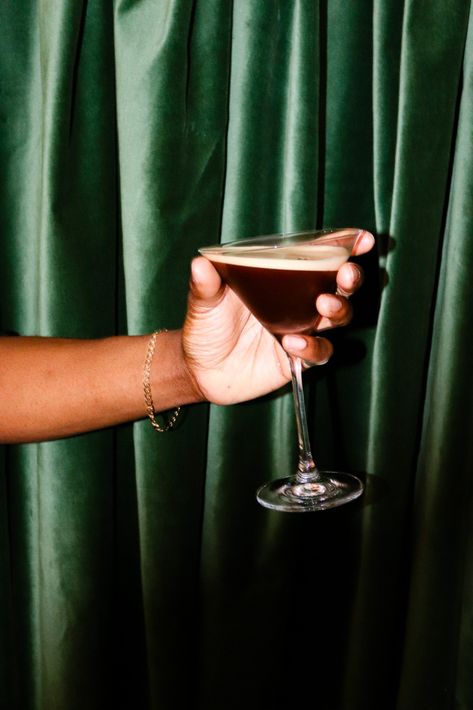 hand holding espresso martini in front of green velvet curtain, cocktail, hoxton spirits, banana rum, Espresso Martini Photography, Esspresso Martini, Espresso Martini Aesthetic, Banana Rum, Espresso Martini Recipe, Cafe Menu Design, Cocktail Illustration, Coffee Shot, Cocktail Photography