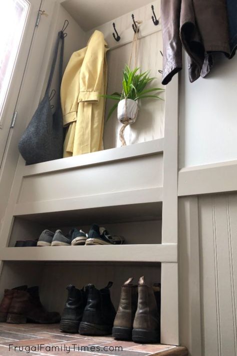 Wish you had space for a mudroom?You just might! We made an organized entryway mudroom space in a tiny stair landing! A built in mudroom may be your entryway storage solution too. We focused our DIY skills on adding a mudroom in a small space - and we've small mudroom ideas for you too! #mudroom #smallspace #entryway #storage #builtin Coat Storage Small Space, Diy Mudroom Wall, Built In Mudroom, Ikea Window Seat, Foyer Decor Ideas, Organized Entryway, Mdf Trim, Entryway Diy, Foyer Wall Decor