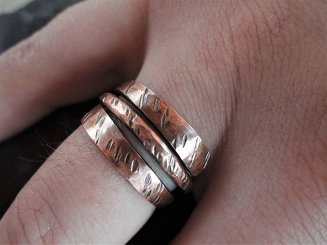 Gorgeous solid copper swirl band, it has been oxidized and textured for a rustic finish. Very comfortable for everyday wear. The texture reminds of grass in a windy day. Makes a  great gift for anniversary or birthday to remember and treasure.  The ring is about 11 mm (0.43 inches) at the widest point.   Will arrive nicely packed ready to become a gift. Choose the ring size you need from the drop menu.  Due to the handmade nature no piece is 100 % identical to the other. Each one is a unique made to make you feel special. This ring can be customized (see the last photo as an example). Please, contact me before ordering to discuss details. There will be additional cost for customization depending on the quantity of letters /numbers.  Do not hesitate to contact me if you have any questions o Hammered Metal Jewelry, Wrap Around Ring, Wire Jewelry Rings, Copper Jewellery, Woven Ring, Gift For Anniversary, Copper Ring, Rustic Jewelry, Textured Ring