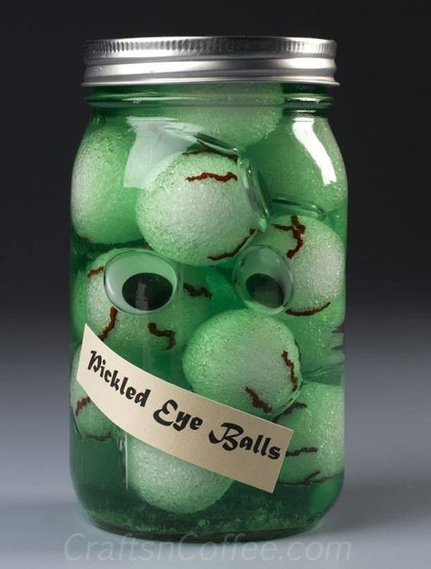 Pickled Eyeballs!  Sounds pretty gruesome, right? But display a few jars of Pickled Eyeballs and wait for the laughs. Pickled Eyeballs have to be one of the best DIY ideas yet for decorating for a Halloween party or haunted house. You can whip up a jar or two fairly quickly – no pressure cooker needed. Waiting for the paint to dry is the hardest part. Eyeballs In A Jar Halloween, Halloween Eyeballs In A Jar, Eyeballs In A Jar, Jar Of Eyeballs, Lab Decorations, Pickle Party, Craft Halloween, Indoor Crafts, Colorful Halloween