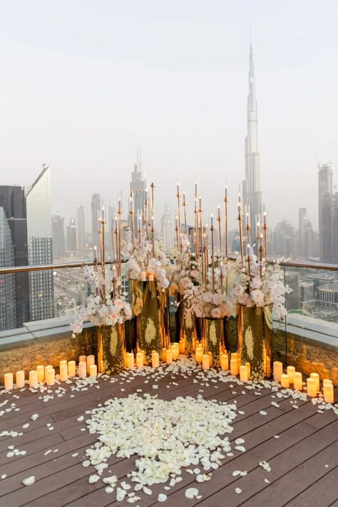 https://www.elegantmoment.ae/gallery/weddings/pearl-of-love.html The Office Proposal, Proposal Centerpieces, Dubai Proposal Ideas, Proposal Floral Decoration, Wedding Proposal Decor, Rooftop Proposal Decorations, Rooftop Party Decorations, Wedding Proposal Decoration Ideas, Candles Proposal