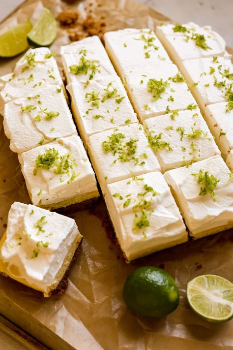 These classic, creamy, tart-sweet Key Lime Pie Bars feature a Biscoff cookie crust, a creamy & easy to make filling and a thick layer of homemade whipped cream. A gorgeous dessert for Spring and Summer! #keylimepie #keylime #keylimepiebars #piebars #summerdesserts #springdesserts #krollskorner #easterdesserts #easterrecipes Key Lime Pie With Biscoff Crust, Biscoff Key Lime Pie, Lime Dessert Recipes, Lime Dessert, Key Lime Bars, Key Lime Pie Bars, Condensed Milk Cookies, Lime Desserts, Baklava Recipe