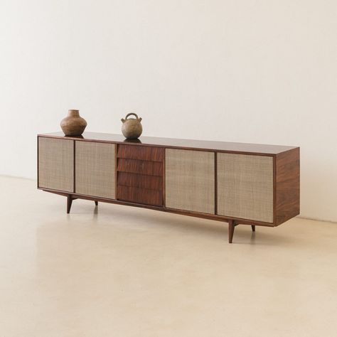 This Credenza was produced by the Brazilian company Tapeçaria Schulz S.A in the 1950s, capturing the eye. Made of solid Caviuna and cane, it has four-door compartments and four carefully made drawers. The item showcases distinctive construction elements, fitting in both living and dining areas, complemented by the addition of... 1960s Bar, Credenza Design, Dresser As Nightstand, History Design, The 1950s, Glass Shelves, Storage Ottoman, Fabric Collection, The Eye