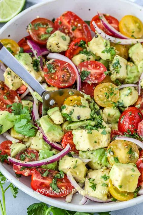 My friends love this avocado salad. It is filled with avocados, tomatoes, red onion, and cilantro tossed in a tangy dressing!  Don't miss out on one of the best summer salads! #spendwithpennies #avocadosalad #sidedish #maincourse #healthyrecipe Cucumber Tomato Avocado Salad, Chicken Foil Packets, Layer Salad, Cherry Tomato Salad, Avocado Tomato Salad, Creamy Cucumber Salad, Avocado Salad Recipes, Creamy Cucumbers, Spend With Pennies