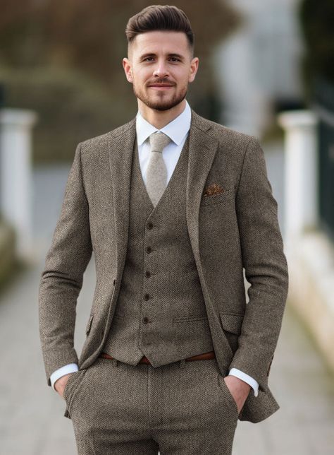 A classic design with a modern silhouette, our Tweed Suit is a must-have for every modern gentleman. Crafted from wool, the unique tweed fabric characterized by its herringbone weave structure that is famous for its warmth and durability makes this suit an ideal transitional piece for business or formal events. Combine it with a matching waistcoat, blue shirt, a patterned tie and polished brogue shoes.   Look Includes  Vintage Dark Brown Herringbone Tweed  Horn Brown Buttons  Notch Lapel   Doubl English Wedding Groom Suit, Unique Groom Outfit, Grey And Brown Wedding, Peaky Blinders Wedding Suits, Tweed Groom Suit, Groom Suit Vintage, Rustic Wedding Suit, Groom Suit Tweed, Groom Blue Suit