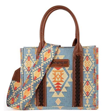 PRICES MAY VARY. Wrangler tote bag makes a bold style statement wherever you go. Wrangler purse features a signature guitar strap. Womens shoulder handbag measures 5"D x 10.7"W x 8.5"H. Western purse has a structured and sturdy silhouette, 2 zip pockets and 2 open pockets included. From the eye-catching aztec print to the cross-stitch woven details, Wrangler aztec tote will be your next everyday purse. Western Purses, Southwestern Print, Boho Purses, Top Handle Handbags, Crossbody Tote Bag, Aztec Pattern, Casual Tote, Small Tote, Crossbody Tote