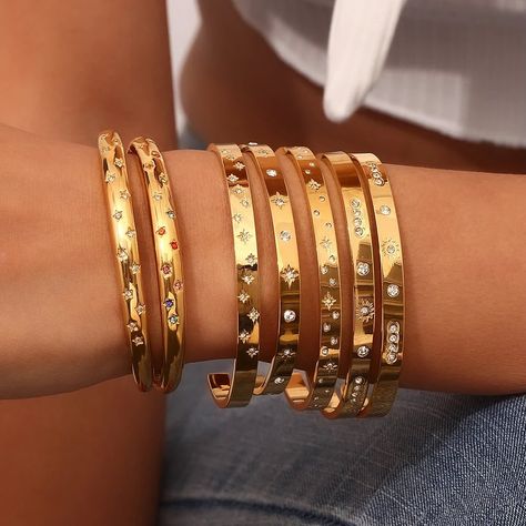 🛍️✨ Discover our dazzling Gold Bangle Collection! These stunning pieces, adorned with sparkling stars and gems, are perfect for any occasion. Stack them up for a bold statement or wear them solo for a chic, minimalist look. Ready to shine? ✨ 🌟 Why You’ll Love Them: • Luxurious gold finish • Beautiful star and gemstone detailing • Versatile and stackable design Shop now and add a touch of elegance to your everyday style!🌟 🛒https://shorturl.at/pYOqu #JewelryLovers #BangleBracelets #Acce... Star Bangle, Sparkling Stars, Gold Plated Bangles, Stainless Steel Bangles, Bangles Bracelets, Cuff Bangle Bracelet, Stacked Bangles, Freshwater Pearl Bracelet, Gold Bracelet Cuff