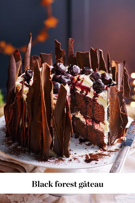 Layers of chocolate sponge, cream and boozy kirsch cherries provide the building blocks for this classic black forest gateau. We’ve decorated ours with chocolate shards, too, for a more striking aesthetic. Try serving it as an alternative Christmas dessert or as a dinner party show-stopper.   #fall #fallaesthetic #fallrecipes #fallbaking #berries #chocolate #chocolate cake Christmas Chocolate Recipes, Black Forest Gateau, Delicious Magazine, Black Forest Cake, Forest Cake, Chocolate Sponge, Mary Berry, Christmas Chocolate, Chocolate Cake Recipe