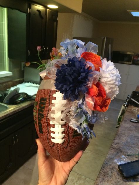 Throwing football bouquet Football Flower Bouquet, Football Bouquet, Senior Night Football, Bf Gift, Mom Flowers, Sports Themed Wedding, Football Wedding, Football Banquet, Football Ideas