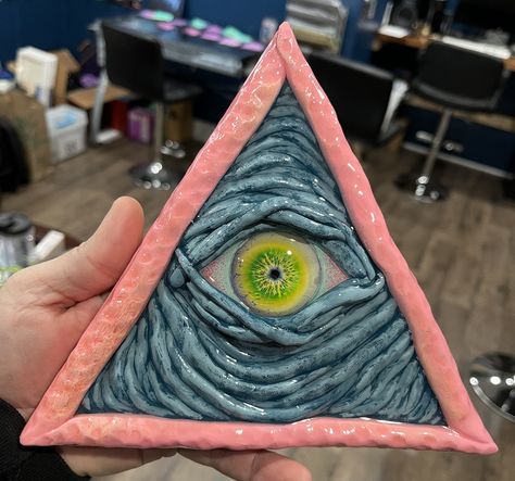 8 inch hand sculpted clay all seeing eye. Hand painted with acrylic paint, resin coated on wood. Wall mount on the back as well as a wood stand for counter tops. Things To Make Out Of Clay, Eye Sculpture, Clay Eye, Larp Props, Dnd Crafts, Paper Mache Clay, Clay Paint, Seeing Eye, Art Carved