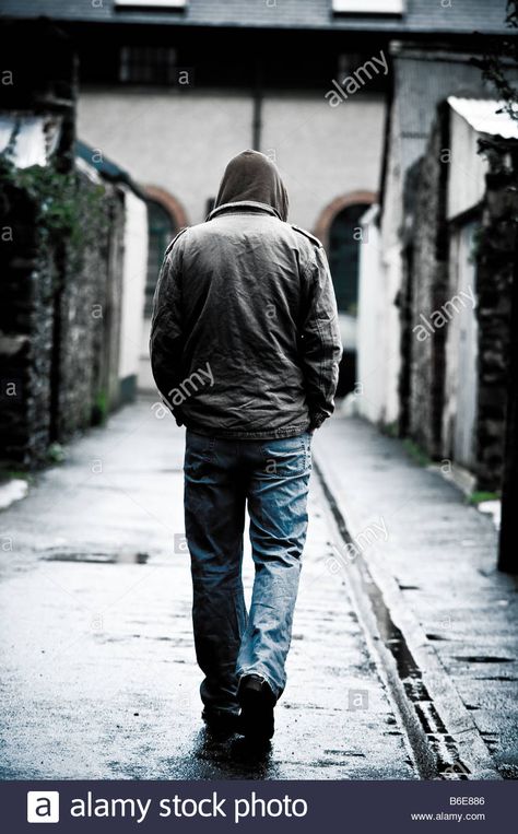 Download this stock image: Young man wearing a hooded jacket alone and isolated walking down an alleyway in a city UK seen from behind walking away - B6E886 from Alamy's library of millions of high resolution stock photos, illustrations and vectors. Walking Behind Reference, Walking From Behind Reference, Man From Behind Reference, Man Walking From Behind, Man From Behind Drawing, Man Walking Reference, Man Walking Drawing, Character From Behind, Person From Behind