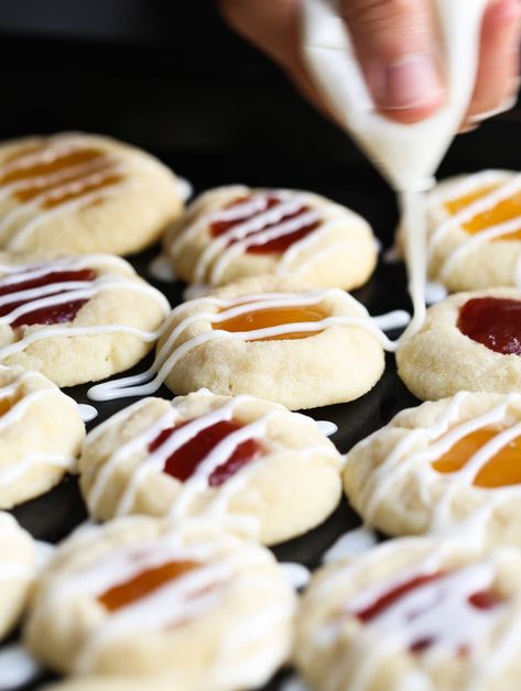 Lemon Thumbprint Cookies are a holiday staple! These easy cookies are sweet and tart with a melty texture. You will fall in love with this cute lemon cookies recipe! #lemon #thumbprint #cookies #lemoncookies #thumbprintcookies #lemoncookiesrecipe #thumbprintcookiesrecipe #easycookiesrecipe Lemon Curd Cookies Recipe, Easy Lemon Cookies, Lemon Thumbprint Cookies, Thumbprint Cookies Easy, Lemon Cookies Easy, Easy Homemade Cookies, Xmas Cookie, Cookie Deserts, Cookie Exchange Recipes