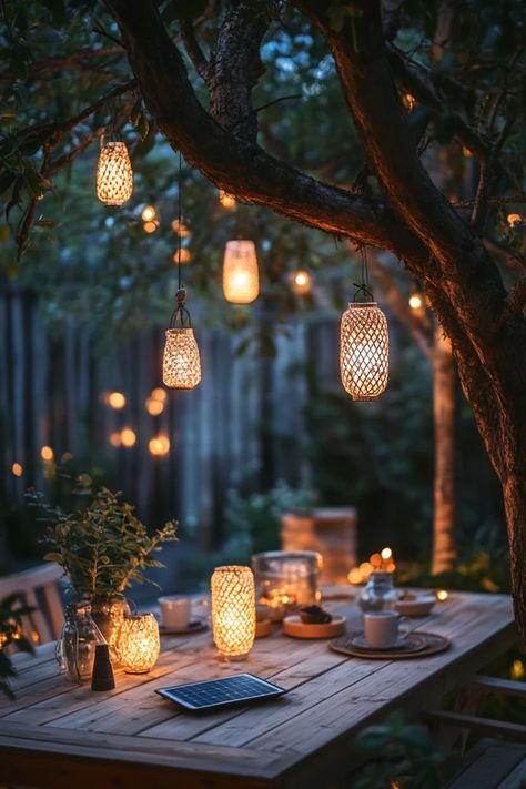 Light up your garden with DIY solar-powered lanterns! This eco-friendly project is simple to make and perfect for adding a warm glow to your outdoor space without using electricity. 🏡✨ #DIYSolarLanterns #EcoFriendlyProjects #SolarPower #GardenLighting #DIYHome Solar Power Garden Lights, Boho Outdoor Lighting, Solar Lights Ideas Outdoor Landscape, Outdoor Patio Chandelier, Garden Lights Ideas Outdoor, Diy Solar Lights Ideas, Garden Lanterns Outdoor, Diy Solar Lanterns, Solar Tree Lights